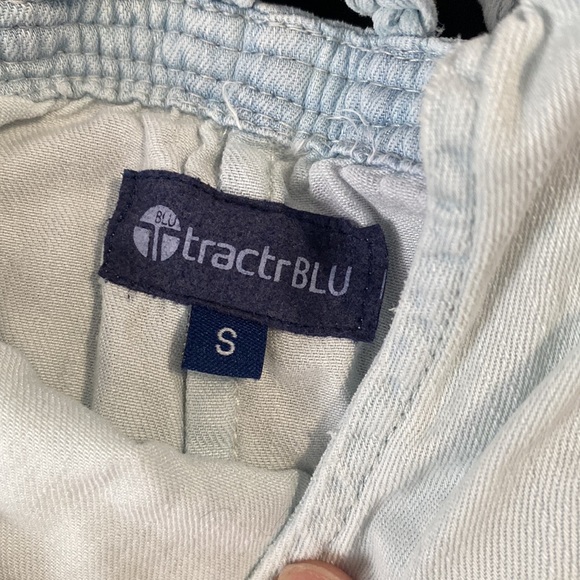 Small Light Blue Denim Romper with Criss Cross Back and Woven accents. - Picture 2 of 2